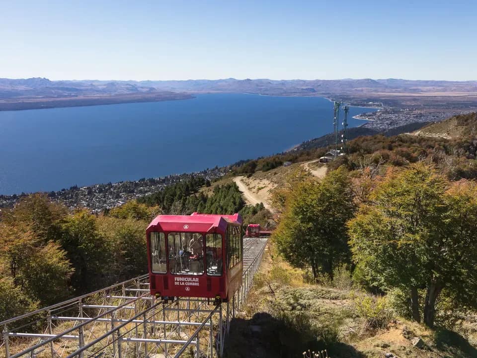 Front view of the summit funicular ascending with Lake Nahuel Huapi in the background